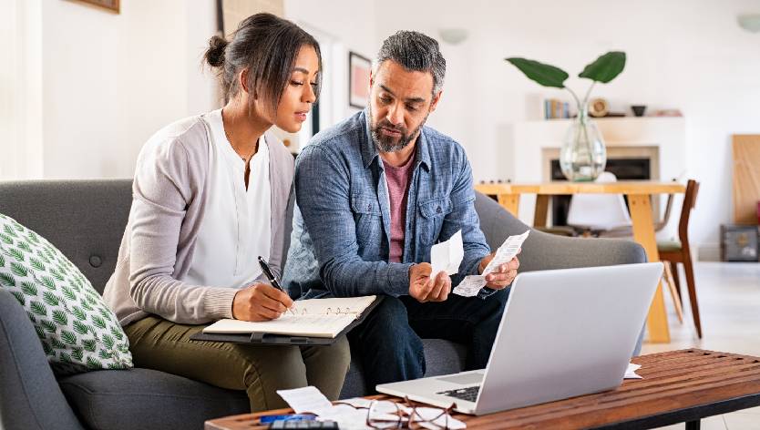 couple looking at their financial papers