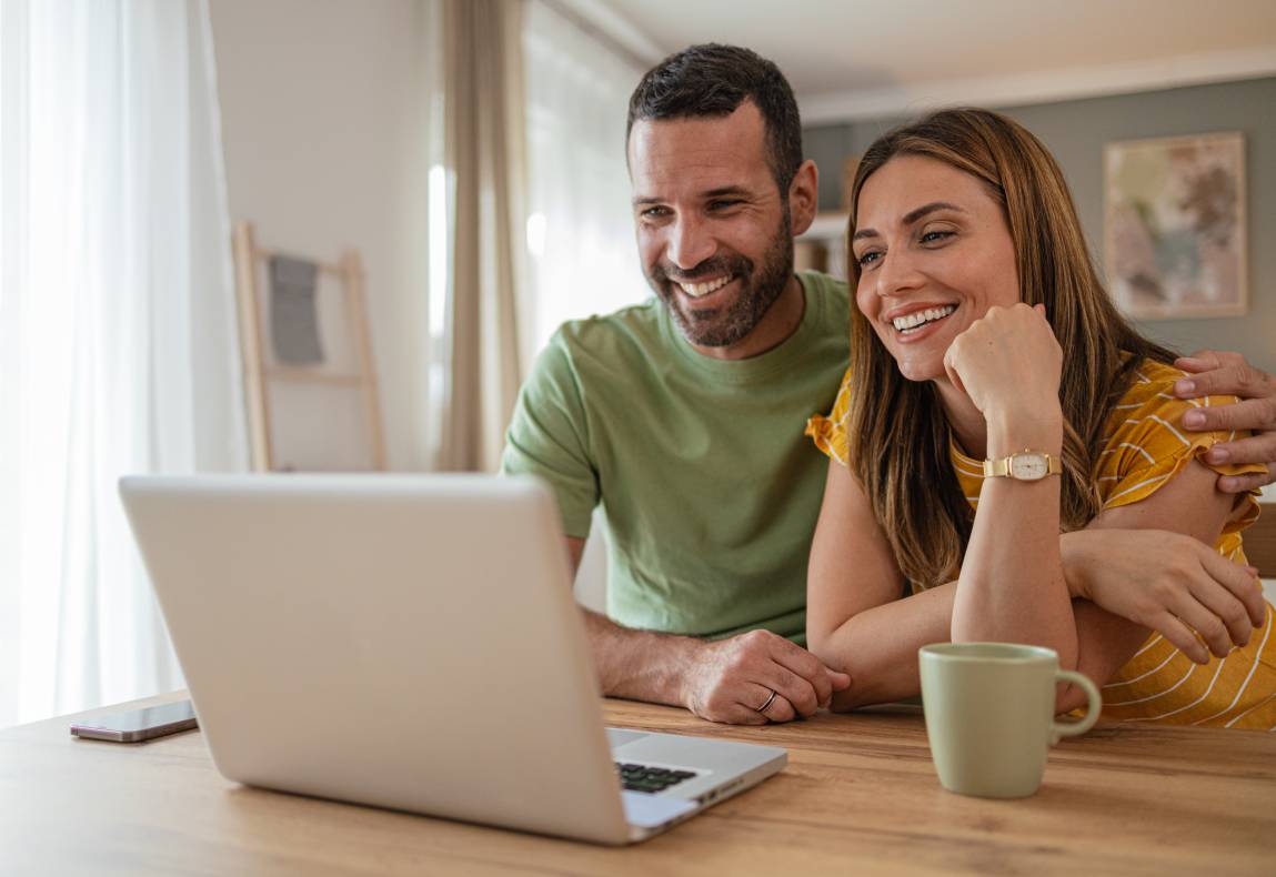 Couple looking at a laptop