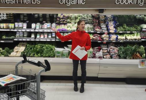 Woman talking in a grocery store