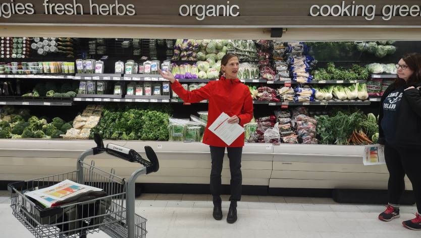 Woman talking in a grocery store