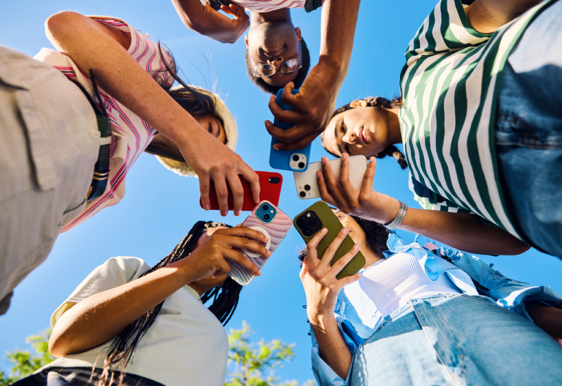 Young adults checking phones