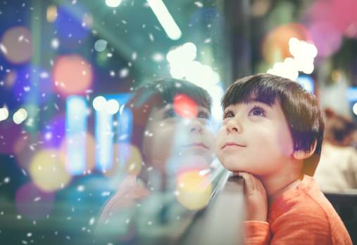 Kid looking at  awindow