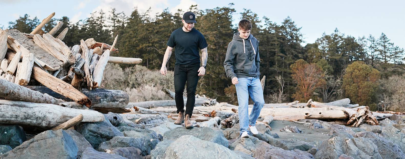 Man and teenager walking on rocks