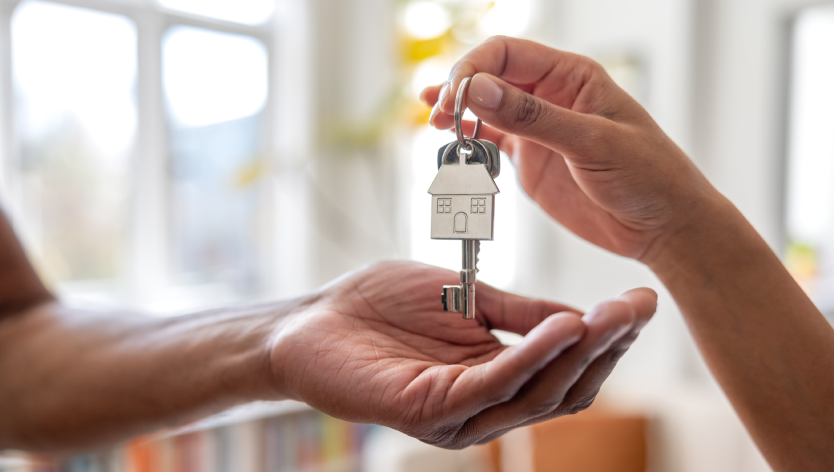Hands holding home keys