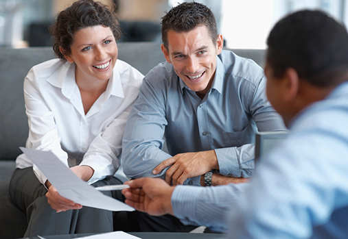 Couple receiving financial advice from an expert