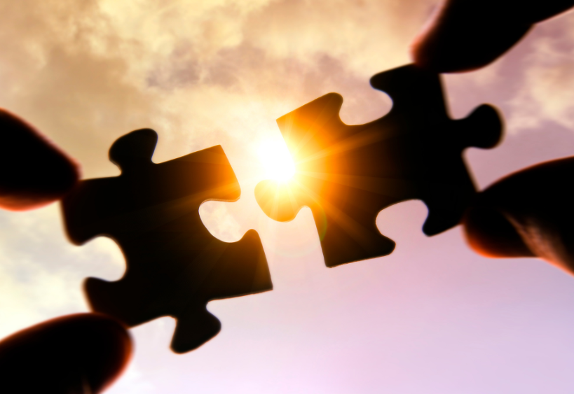 Puzzle pieces going together