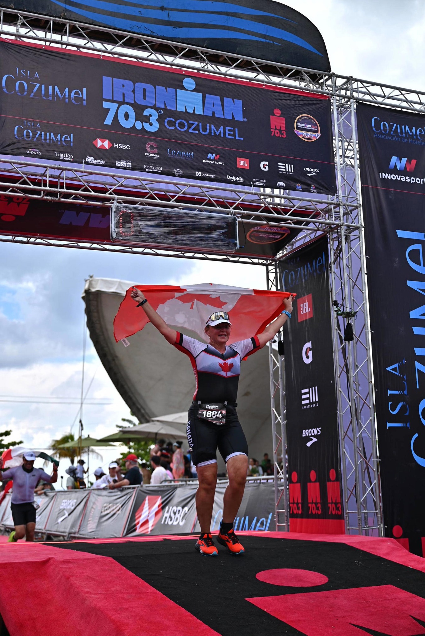 Nadine Tischhauser crossing the Ironman finish line