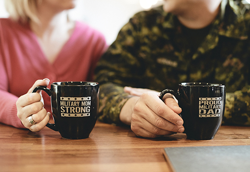 CAF member and wife holding coffee mugs