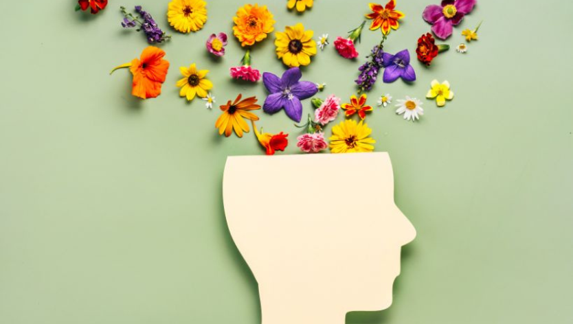  profile image of head with colourful flowers floating out of the top of the head