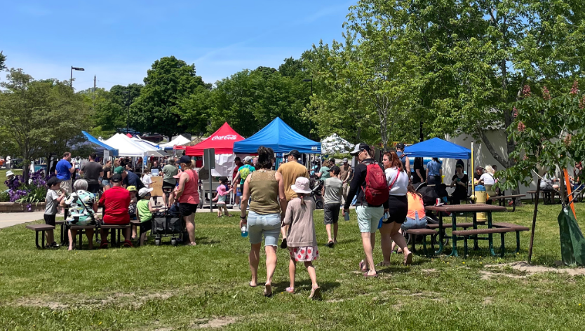 Many people attending outdoor community information event