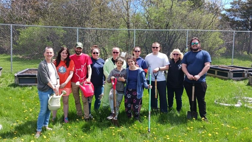 group of people in the KMFRC community garden
