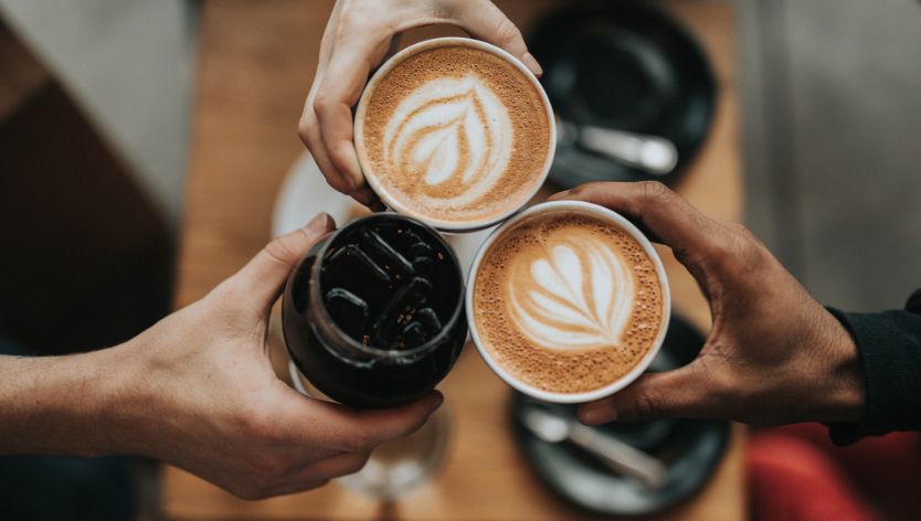 Three women drinking coffee